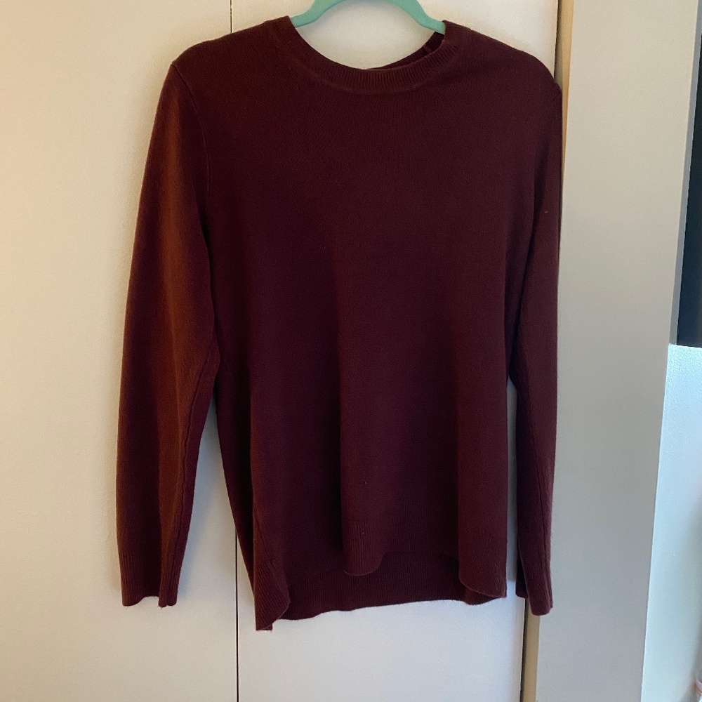 maroon colored crew neck sweater